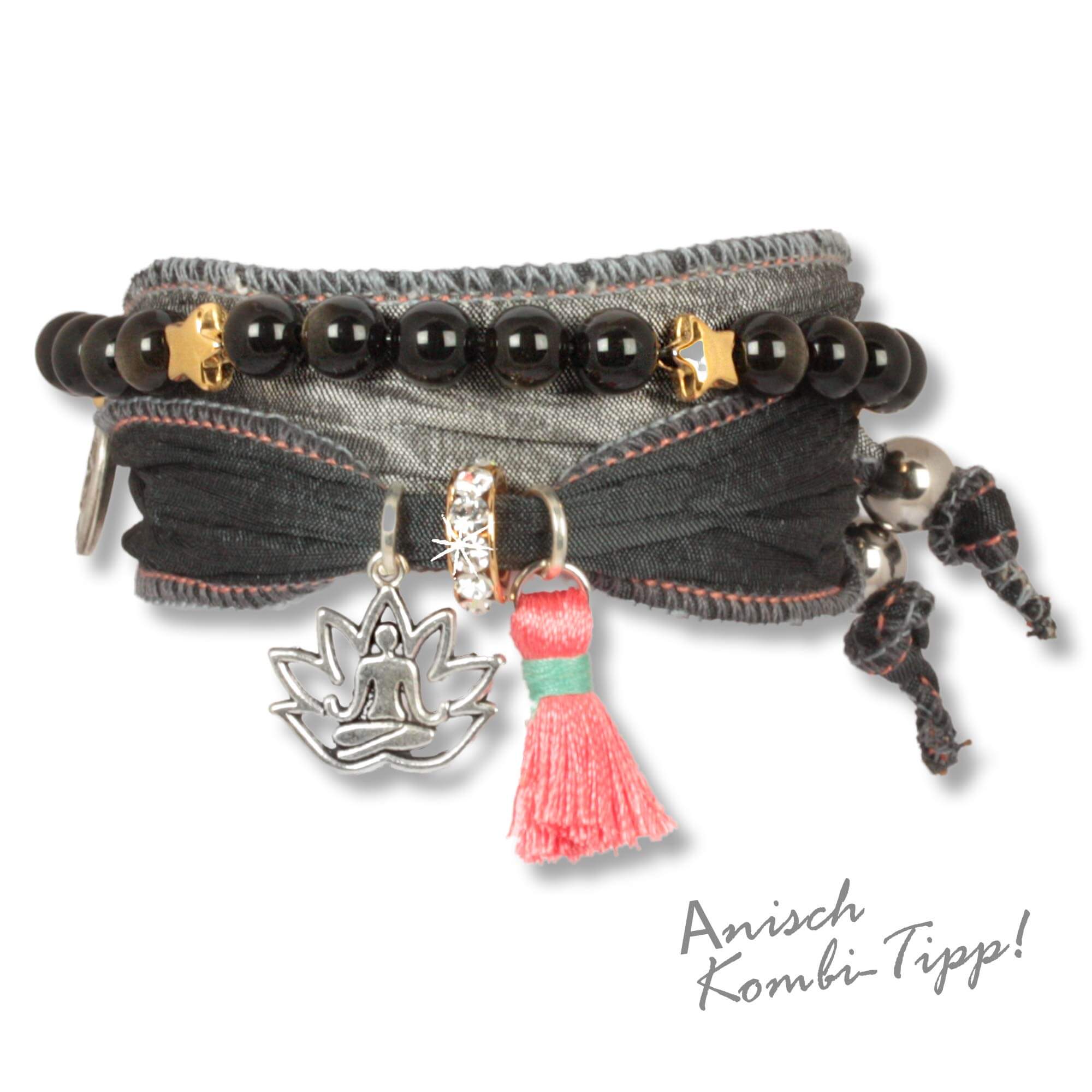 Bracelet made from sarees and silk fabrics in black, anthracite and silver with a lotus pendant, pink tassel and a rondel set with Czech crystals