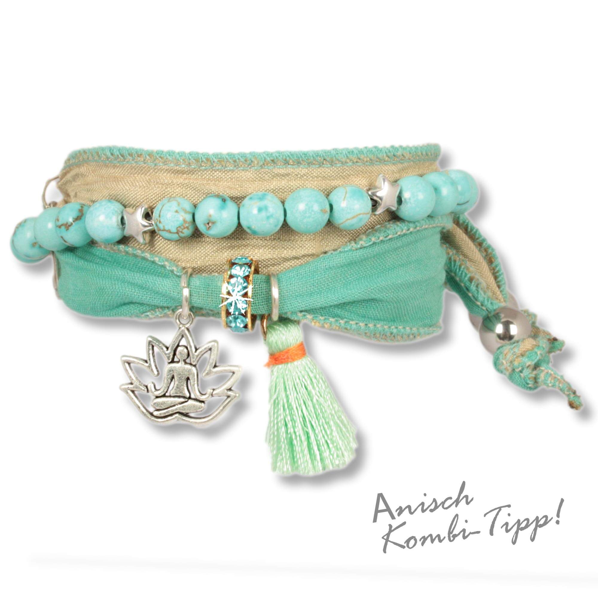 Handmade fabric bracelet made from saris and silk fabrics in mint green and natural colours. Decorated with a metal lotus flower depicting a meditating Buddha, a mint green silk tassel and a rondel set with Czech crystals. Anísch